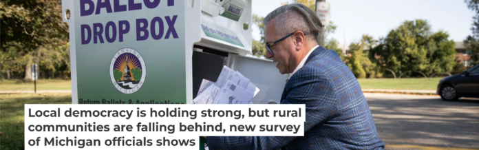 Lansing City Clerk Chris Swope collects absentee ballots from a drop box in 2024. Bill Pugliano/Getty Images